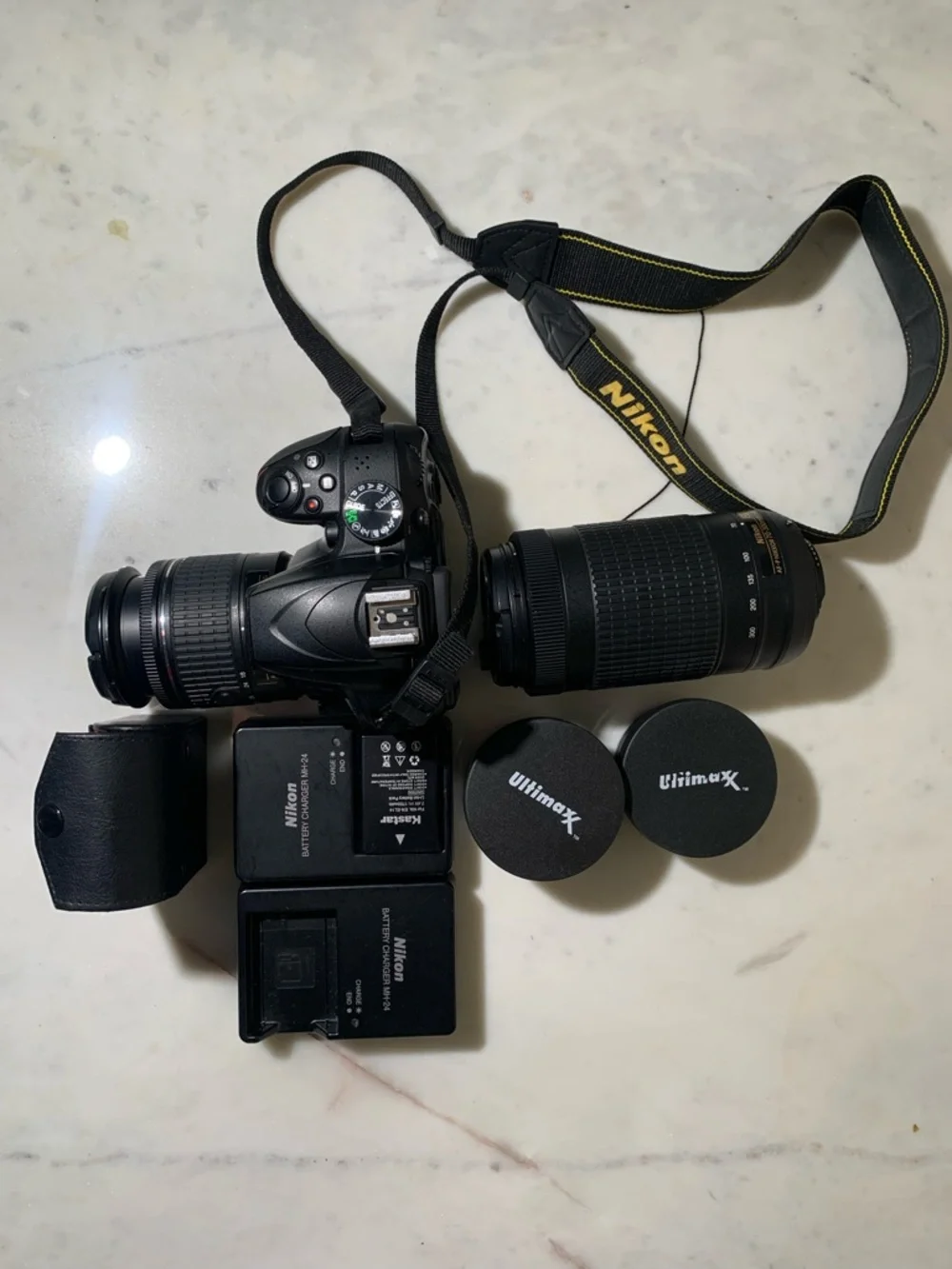 Nikon Black DSLR Camera with Two Zoom Lenses and Accessories
